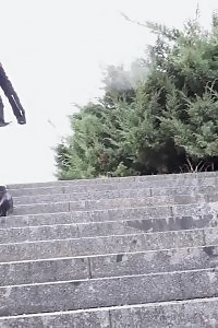Black Haired Babe Pisses Down Concrete Steps