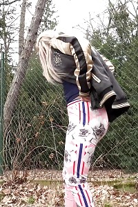 Fearful Looking Light-haired Squats To Pee While Outside