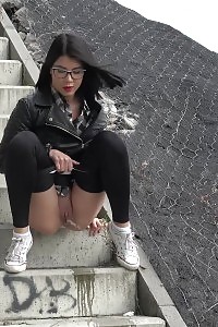 Kinky Black Haired Doll In Glasses Pissing Outside