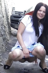 Beautiful Brunette Babe Pissing Behind Parked Cars