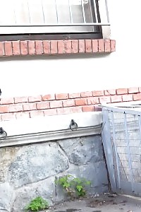 Attractive Light-haired Sprays Golden Pee Onto A Cobbled Path